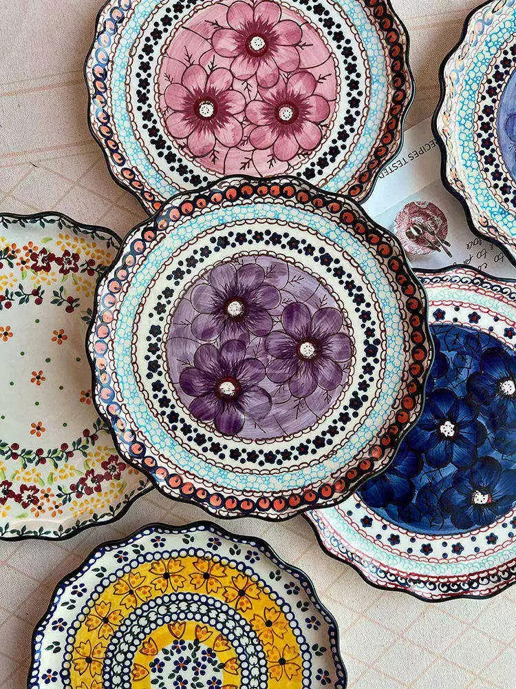 A layered arrangement of floral porcelain plates